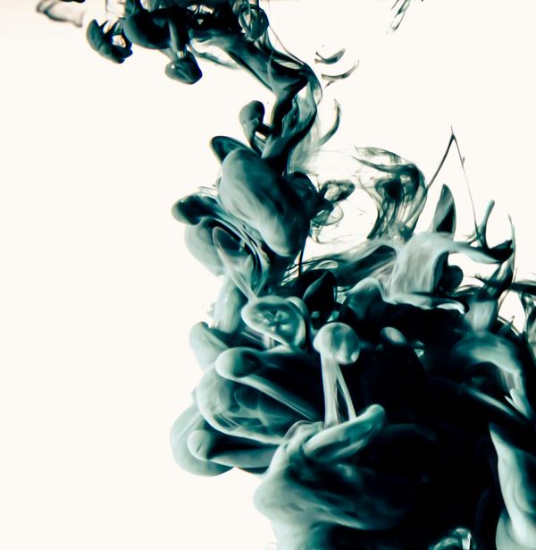 Main image of a person in a fluid yoga movement, dark background.