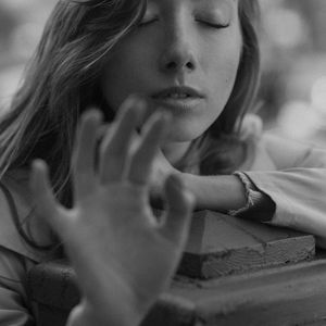 Person in a meditative pose at the end of a session.
